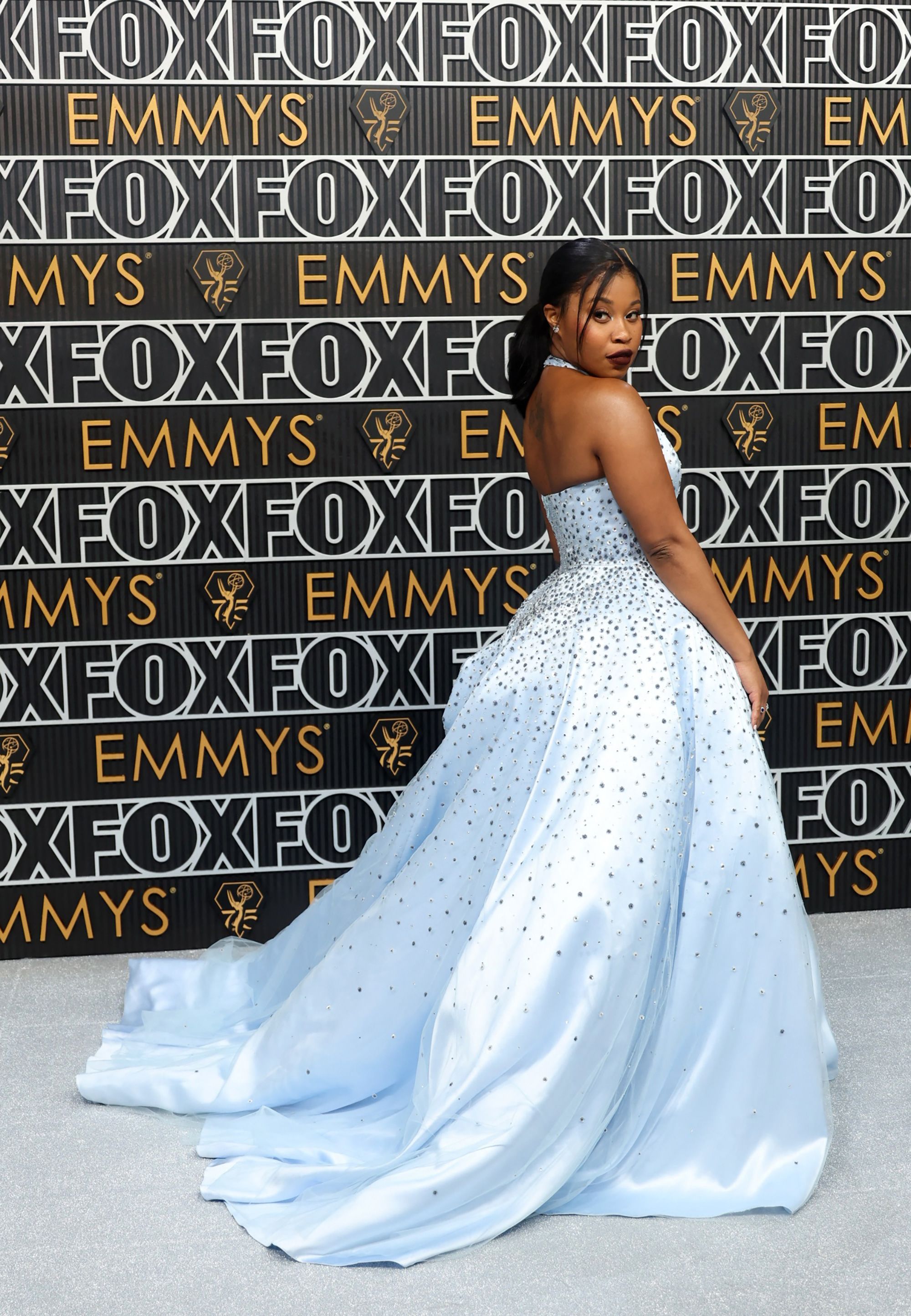 Actor Dominique Fishback, who was nominated for her performance in “Swarm,” stood out in a powder-blue Miu Miu princess gown with jewel detailing.
