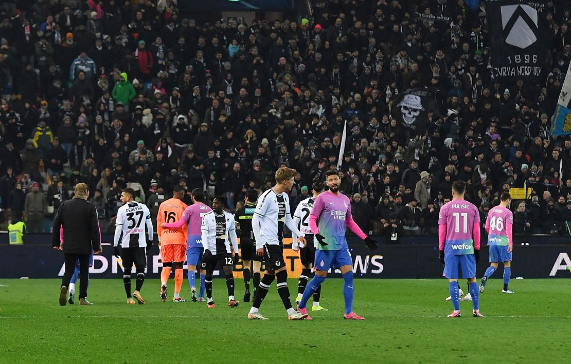 AC Milan players react after Maignan was racially abused by Udinese fans.