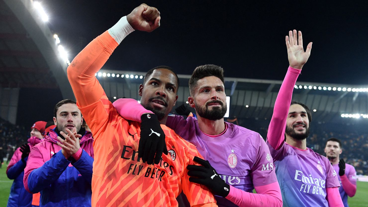 AC Milan's Mike Maignan and Olivier Giroud applaud fans after the match against Udinese.