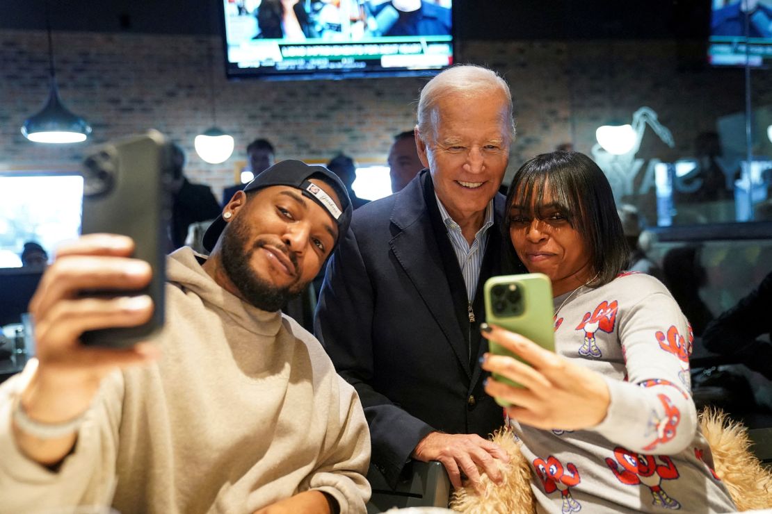 President Joe Biden poses for a selfie with diners at They Say restaurant in Detroit on Thursday.