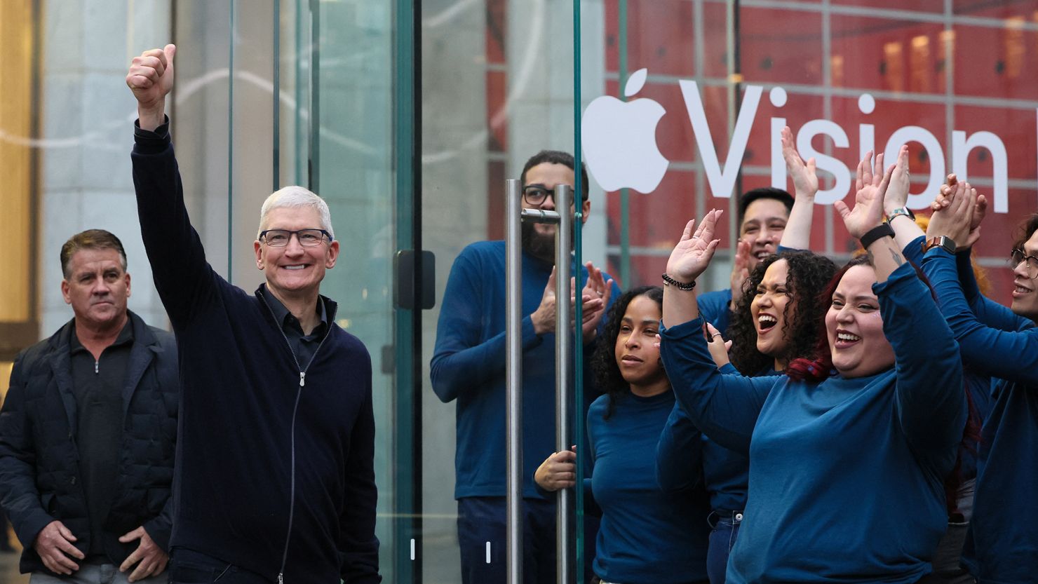 Apple CEO Tim Cook and Apple employees greet customers who arrive to buy Apple's Vision Pro headset at the Apple Fifth Avenue store in Manhattan in New York City, U.S., February 2, 2024.