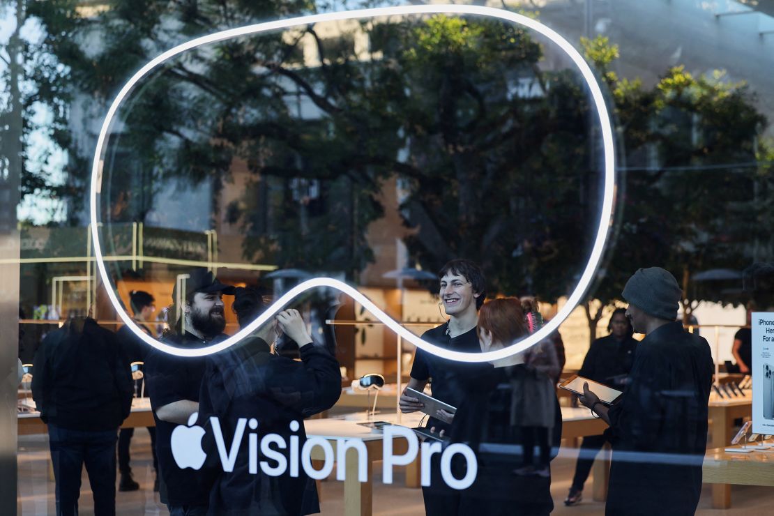 Employees stand in an Apple store on the day Apple's Vision Pro headset goes on sale for the first time in Los Angeles, California, on February 2, 2024.