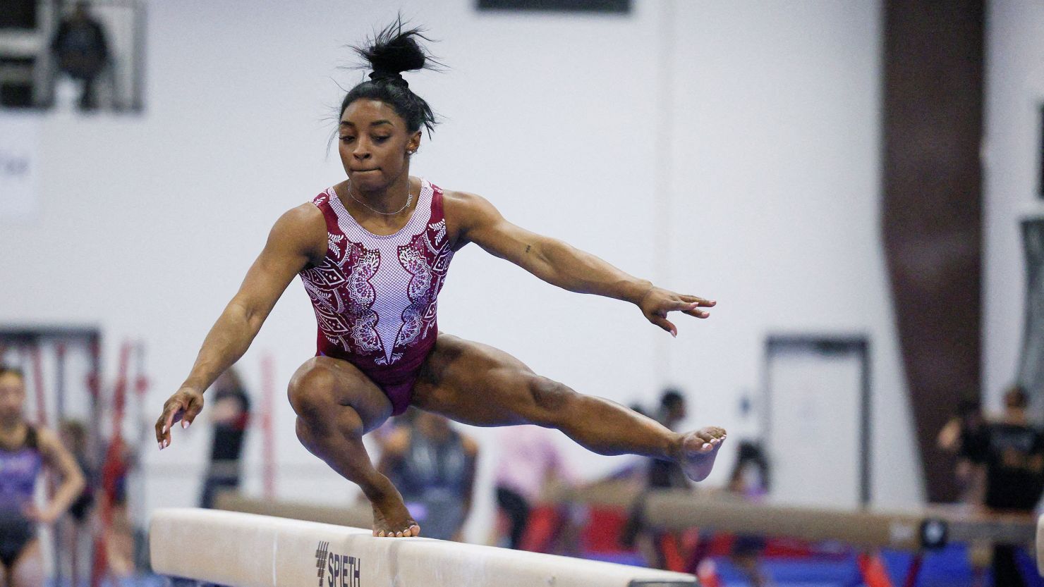 Simone Biles runs through her beam routine months out from the Paris Olympics.