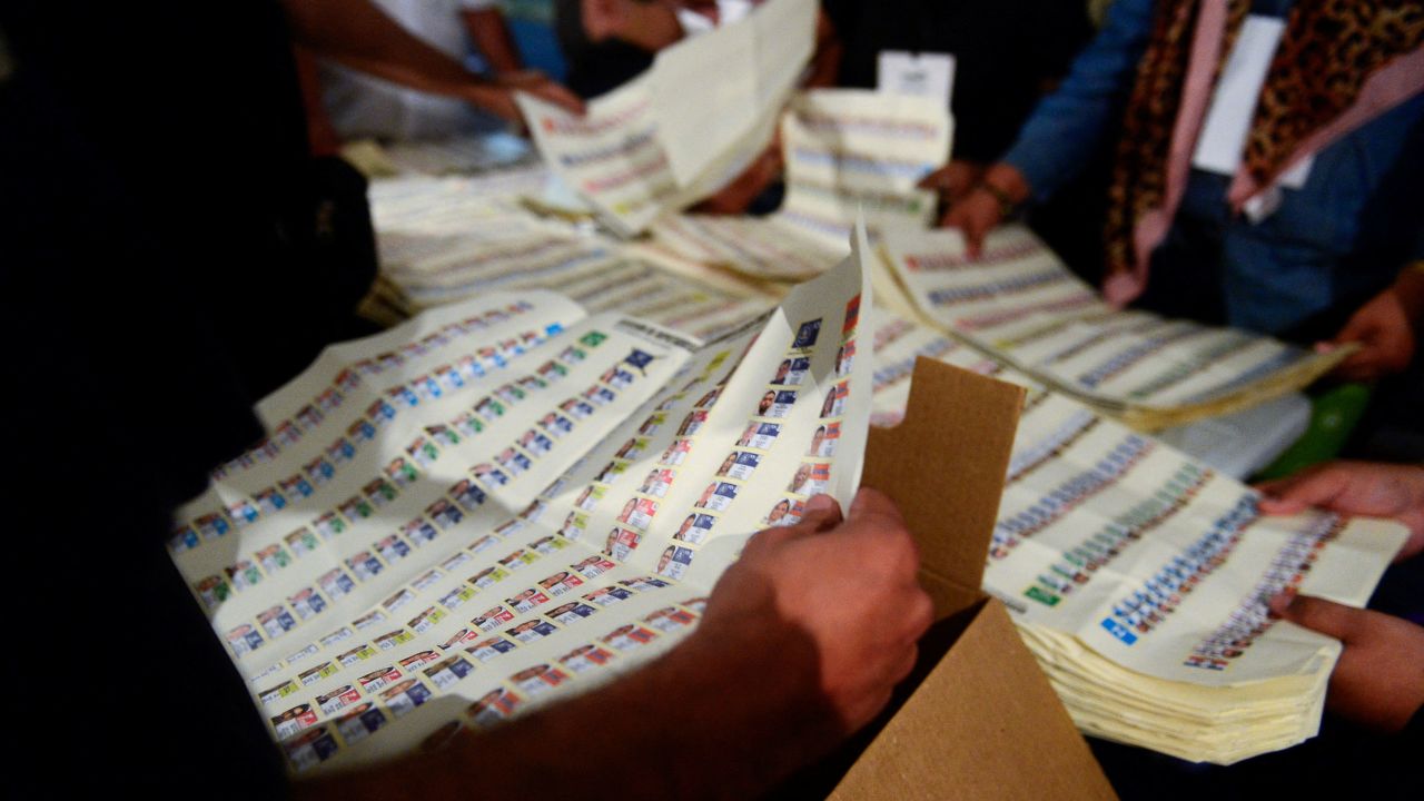 Election workers count ballots at a polling station during the presidential and parliamentary elections in San Salvador, El Salvador, February 4, 2024. REUTERS/Jessica Orellana
