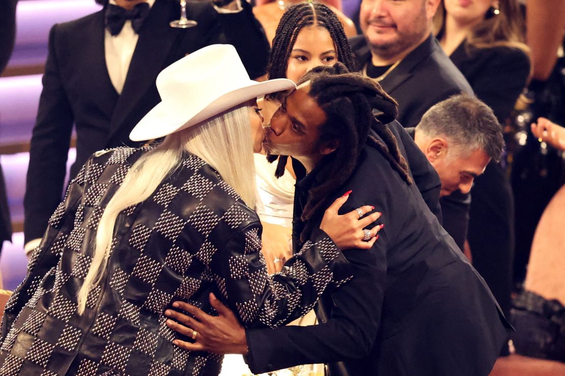 Jay Z and Beyoncé embrace during the Grammy Awards in Los Angeles, in February. The couple have three children, Blue Ivy, and twins Sir and Rumi - who features on the track "Protector" in "Cowboy Carter."