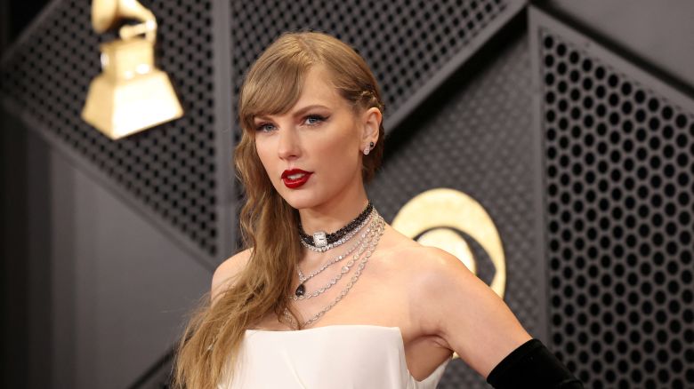 Taylor Swift poses on the red carpet as she attends the 66th Annual Grammy Awards in Los Angeles, California, U.S., February 4, 2024.