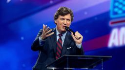 FILE PHOTO: Tucker Carlson speaks as conservative leaders and personalities attend Turning Point USA's AmericaFest 2023 in Phoenix, Arizona, U.S. December 18, 2023. REUTERS/Caitlin O’Hara/File Photo