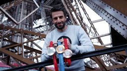 Tony Estanguet, president of the Paris 2024 Olympics organizing committee, poses with Olympic and Paralympic Games medals on the Eiffel Tower.