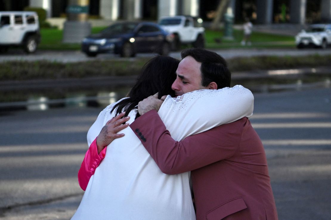 Carlos Gonzalez, a worship singer, hugs a fellow churchgoer after a shooting at Joel Osteen's Lakewood Church in Houston.