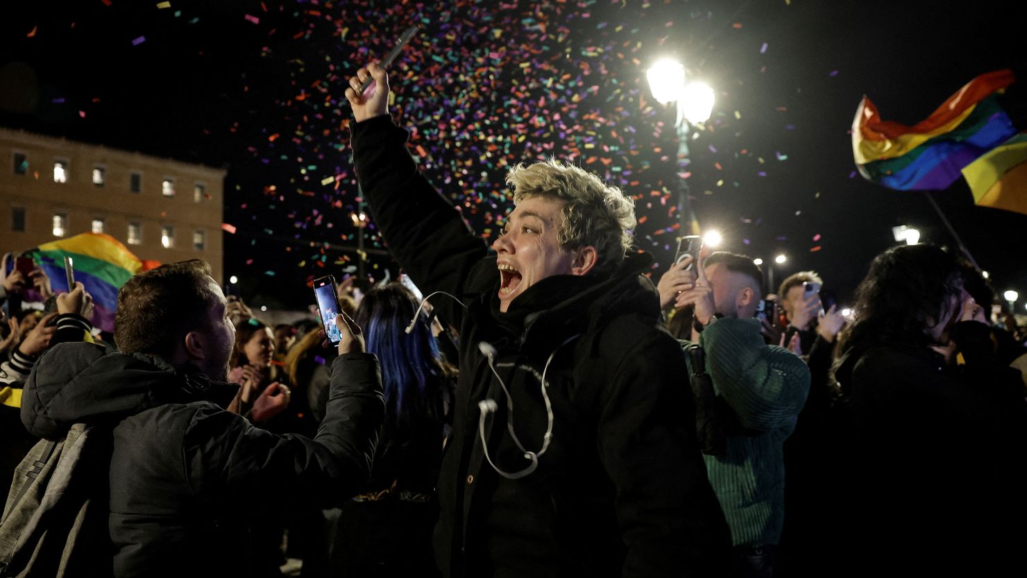 Members of the LGBTQ+ community and supporters celebrate in front of the Greek parliament, after the vote in favor of a bill that approved allowing same-sex civil marriages, in Athens on February 15.