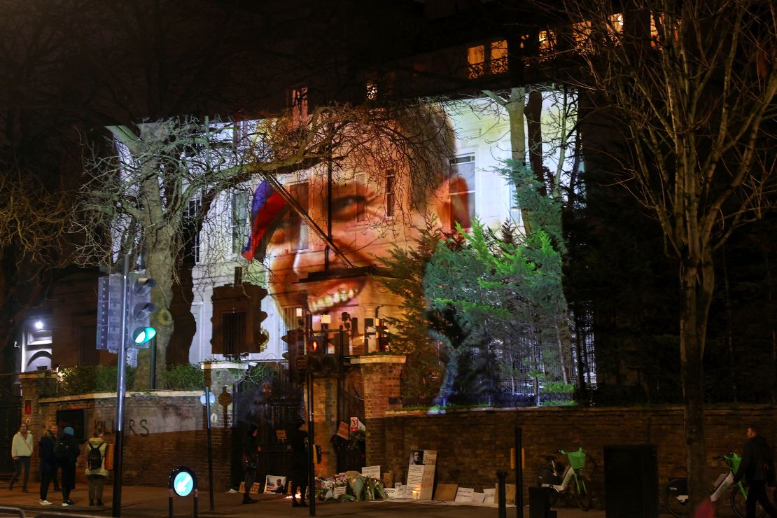 An image of Russian opposition leader Alexei Navalny is projected on the Russian Embassy in London on the day his death was announced.