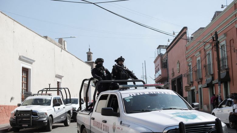Police officers patrol following the killing of a mayoral candidate who was gunned down in Maravatio, Michoacan state, Mexico, on February 27. There have been at least 15 candidate deaths since the electoral process began on October 1, according to the Mexican government.