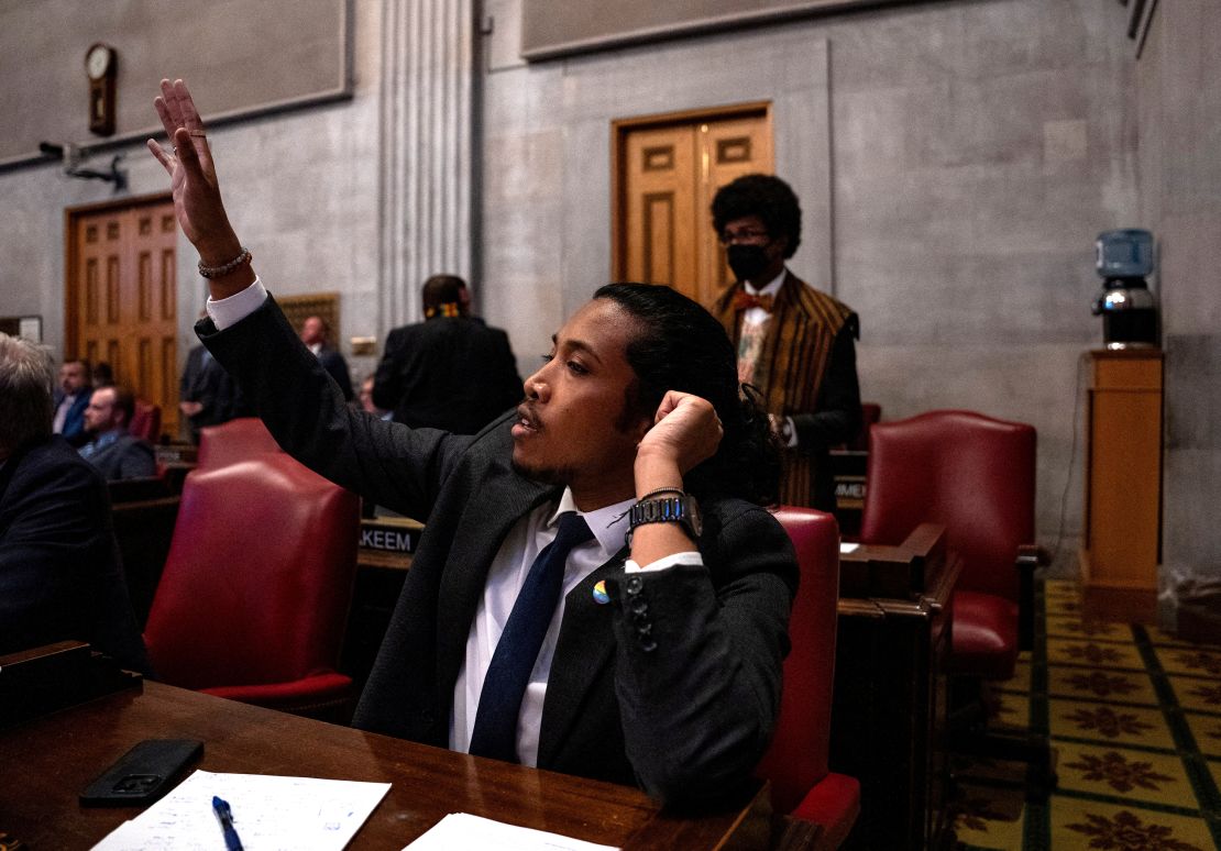 Rep. Justin Jones raises his hand to be called on to speak on bill HB 2716 at the Tennessee State Capitol building during a general session in Nashville, Tennessee, on February 26, 2024.