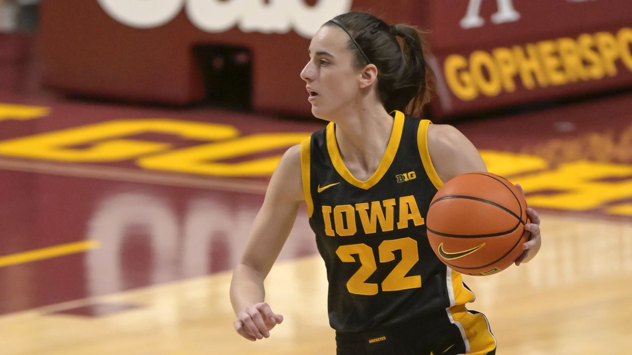 Feb 28, 2024; Minneapolis, Minnesota, USA; Iowa Hawkeyes guard Caitlin Clark (22) brings the ball up-court against the Minnesota Golden Gophers during the first quarter at Williams Arena. Mandatory Credit: Nick Wosika-USA TODAY Sports