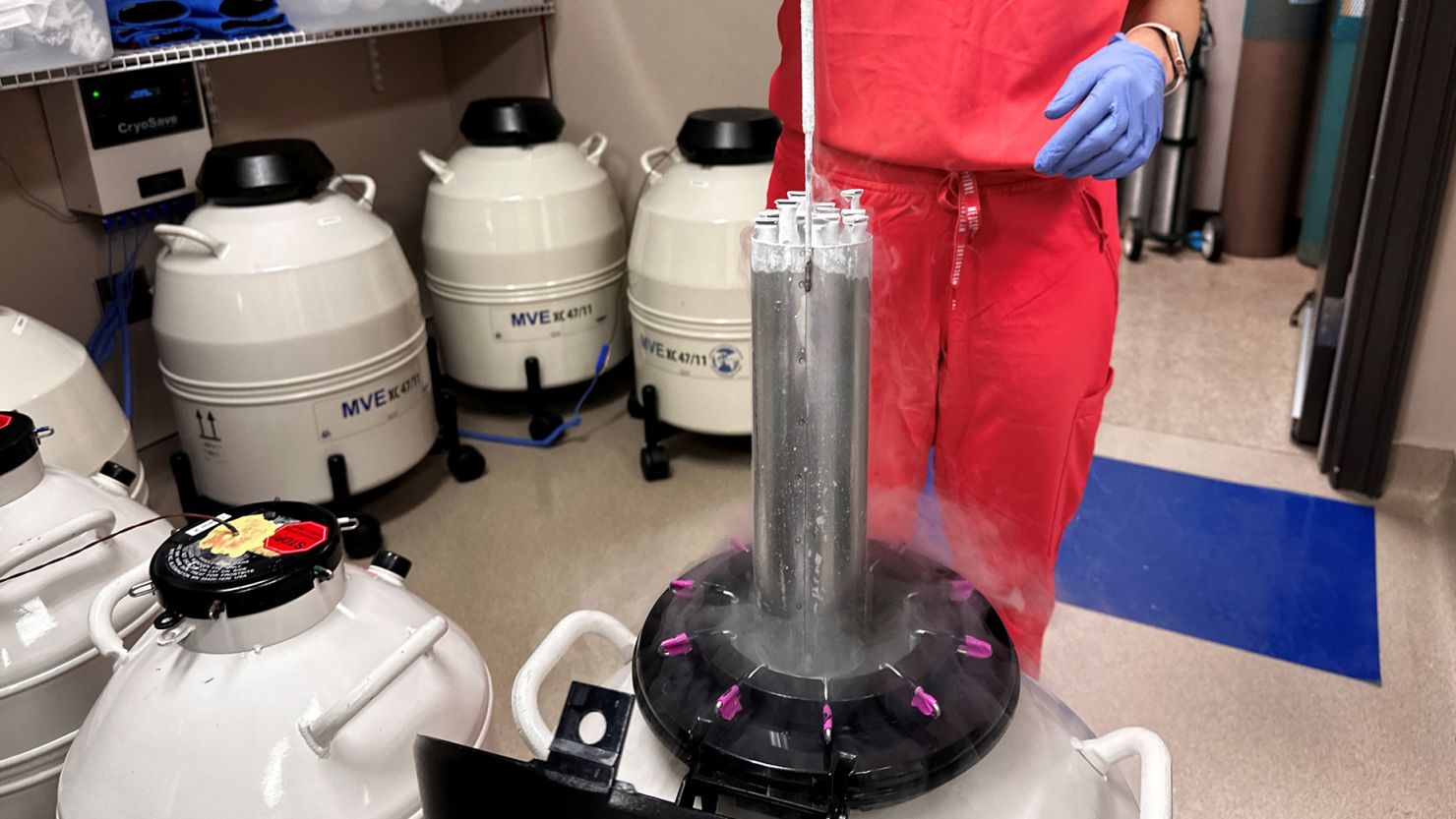 A nurse practitioner for Huntsville Reproductive Medicine lifts frozen embryos out of IVF cryopreservation storage in Madison, Alabama, on March 4.