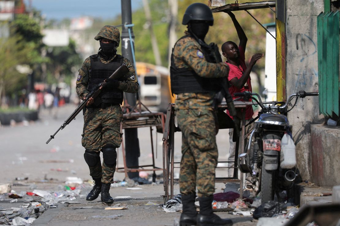 Police officers patrol in Port-au-Prince on March 9 as Haiti remains in a state of emergency.