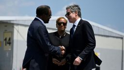 US Secretary of State Antony Blinken is greeted by US Ambassador to Jamaica, N. Nick Perry upon arrival at Norman Manley International Airport, in Kingston, Jamaica, on March 11.