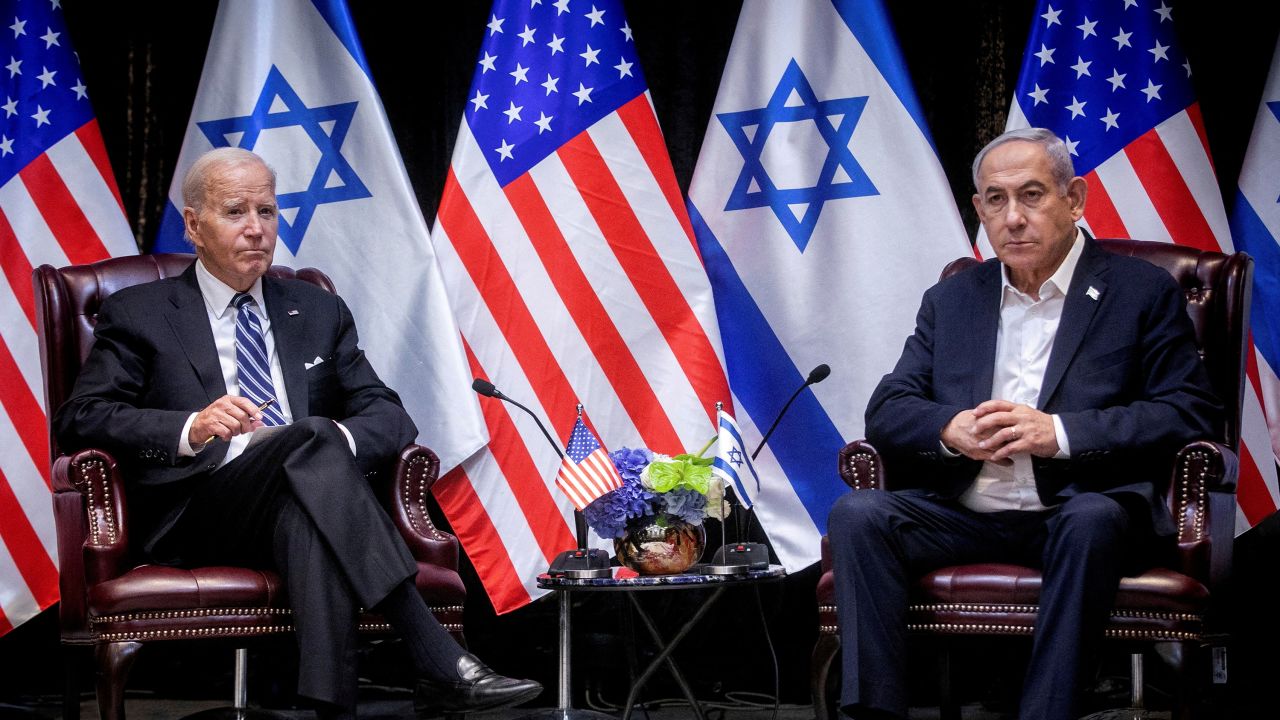 FILE PHOTO: U.S. President Joe Biden, left, pauses during a meeting with Israeli Prime Minister Benjamin Netanyahu, right, to discuss the war between Israel and Hamas, in Tel Aviv, Israel, Wednesday, Oct. 18, 2023. Miriam Alster/Pool via REUTERS//File Photo