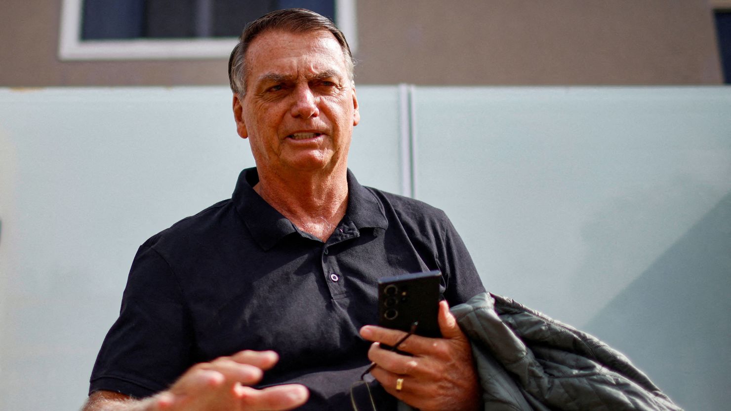 Former Brazilian President Jair Bolsonaro in front of his house before testifying to the Federal Police in Brasilia, Brazil, on February 22, 2024.