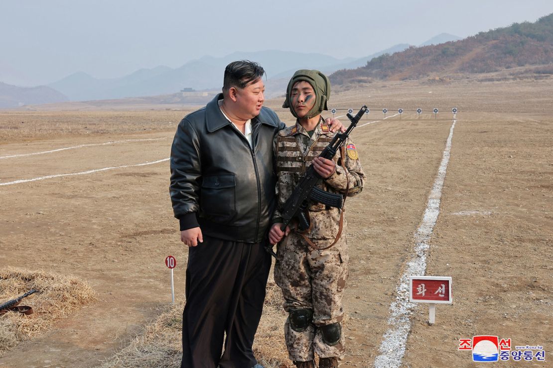 North Korean leader Kim Jong Un interacts with a soldier during the training of the Korean People's Army's air and amphibious combat units in this picture released on March 16, 2024, by the Korean Central News Agency.