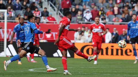 Mar 16, 2024; Chicago, Illinois, USA; Chicago Fire FC midfielder Kellyn Acosta (23) kicks the ball against CF Montreal midfielder Mathieu Choiniere (29) to score a long goal during the second half at Soldier Field. Mandatory Credit: Mike Dinovo-USA TODAY Sports