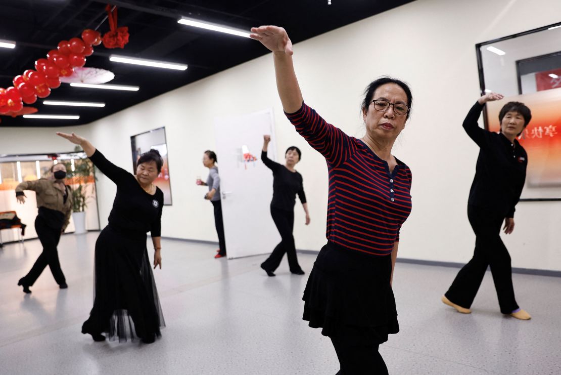 Retired kindergarten teacher Ma Qiuhua, 67, practices dance with other elderly women at Mama Sunset, a learning centre for middle-aged and senior people in Beijing, China, January 15, 2024.