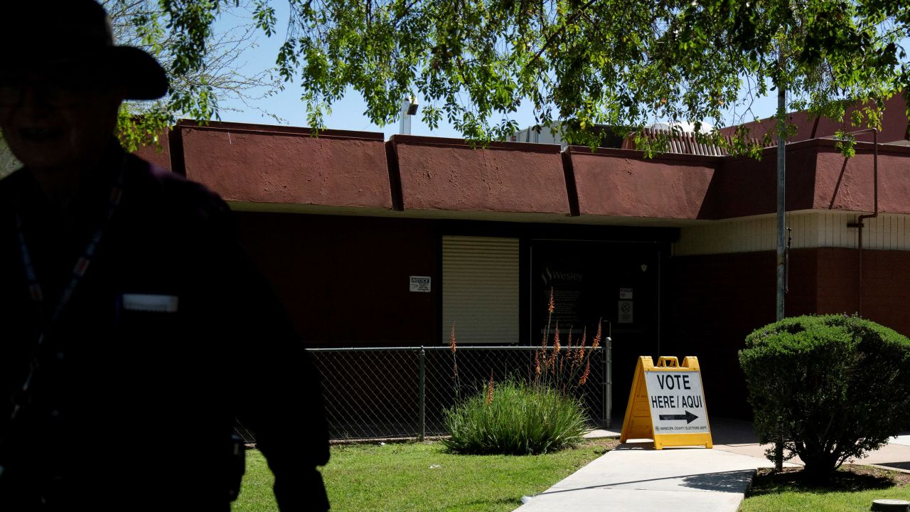 A man walks outside of a polling place in Phoenix, Arizona, during a primary election on March 19, 2024.