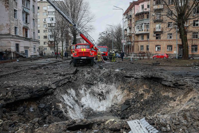 Rescuers work at a site of a building damaged during a Russian missile strike.
