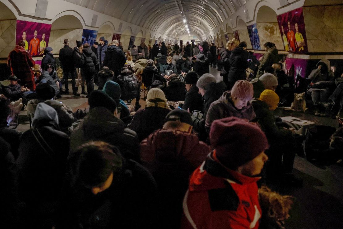 People take shelter inside a metro station in Kyiv during the missile barrage.