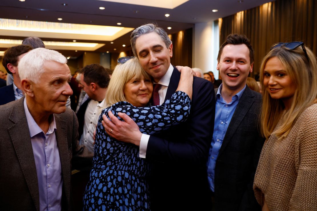 Simon Harris embraces his family after being announced as the new leader of Fine Gael.