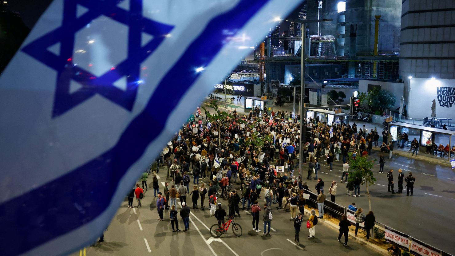People block a road during a demonstration calling for the return of hostages held in Gaza since October 7, in Tel Aviv, Israel March 26, 2024.