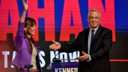 Independent presidential candidate Robert F. Kennedy, Jr. gestures next to Nicole Shanahan in Oakland, California, on March 26, 2024.