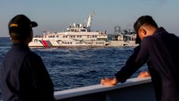 FILE PHOTO: Members of the Philippine Coast Guard stand alert as a Chinese Coast Guard vessel blocks their way to a resupply mission at Second Thomas Shoal in the South China Sea, March 5, 2024. REUTERS/Adrian Portugal/File Photo