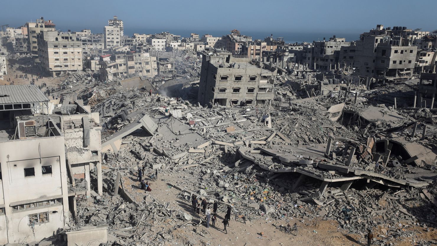 Palestinians survey the destruction at Al Shifa Hospital after Israel's withdrawal, April 1, 2024.
