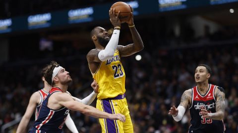 Apr 3, 2024; Washington, District of Columbia, USA; Los Angeles Lakers forward LeBron James (23) shoots the ball as Washington Wizards forward Corey Kispert (24) defends in the first half at Capital One Arena. Mandatory Credit: Geoff Burke-USA TODAY Sports
