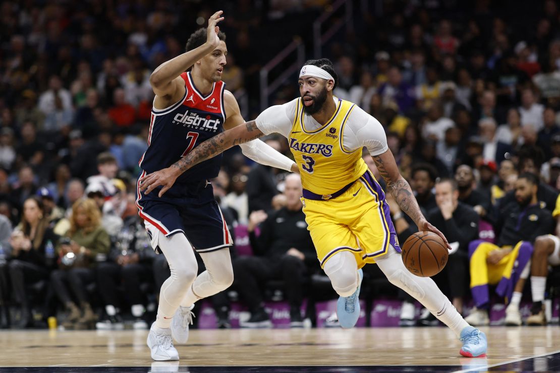 Apr 3, 2024; Washington, District of Columbia, USA; Los Angeles Lakers forward Anthony Davis (3) drives to the basket as Washington Wizards forward Patrick Baldwin Jr. (7) defends in the first half at Capital One Arena. Mandatory Credit: Geoff Burke-USA TODAY Sports
