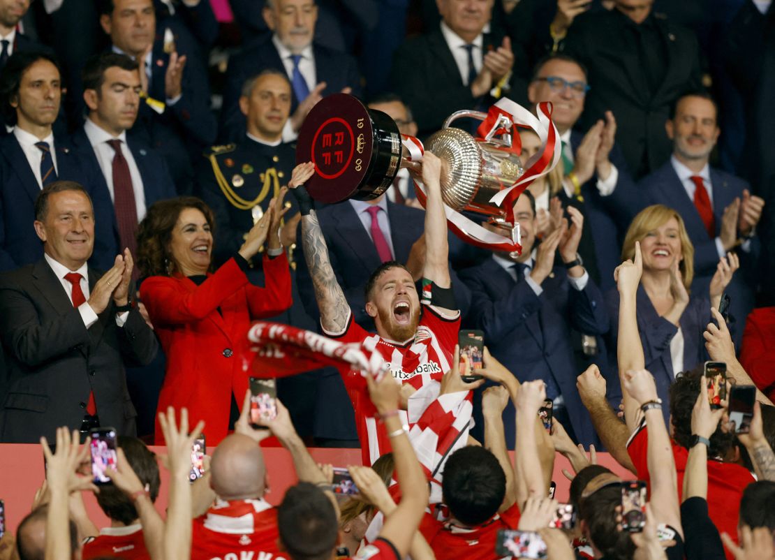Athletic captain Iker Muniain lifts the Copa del Rey trophy.
