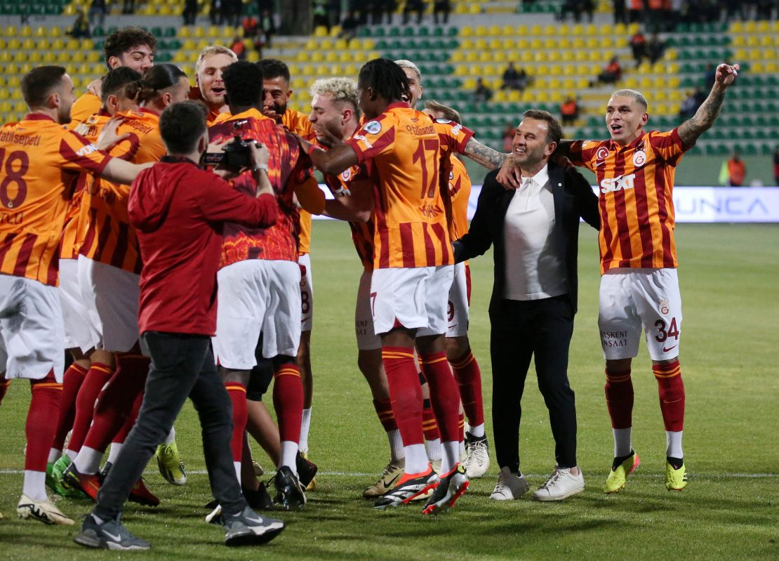 Galatasaray players celebrate their unusual Super Cup victory.
