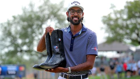 Apr 7, 2024; San Antonio, Texas, USA; Akshay Bhatia poses with a pair of boots after winning the playoff during the final round of the Valero Texas Open golf tournament. Mandatory Credit: Erik Williams-USA TODAY Sports