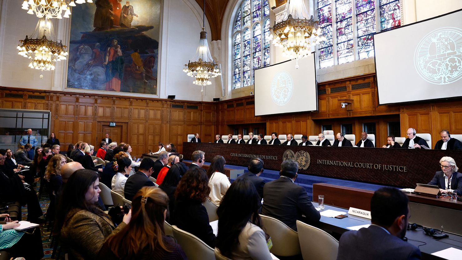 Judges and delegates sit in the courtroom as the International Court of Justice (ICJ) hears the case against Germany brought by Nicaragua.