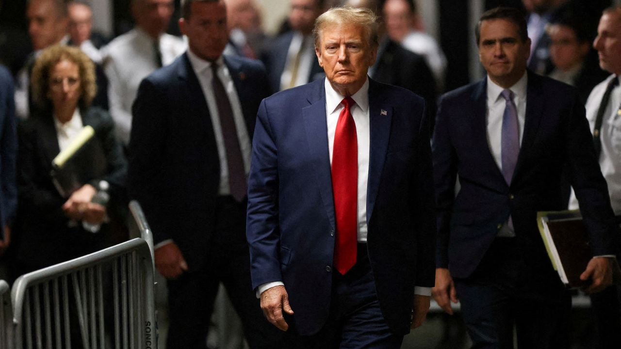 FILE PHOTO: Former U.S. President Donald Trump walks outside the courtroom on the day of a court hearing on charges of falsifying business records to cover up a hush money payment to a porn star before the 2016 election, in New York State Supreme Court in the Manhattan borough of New York City, U.S., February 15, 2024. REUTERS/Andrew Kelly/File Photo