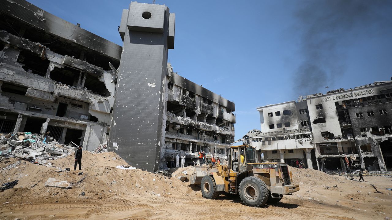 Rescuers and medics search for dead bodies inside the damaged Al Shifa Hospital after Israeli forces withdrew from the hospital and the area around it following a two-week operation, amid the ongoing conflict between Israel and Hamas, in Gaza City April 8, 2024.