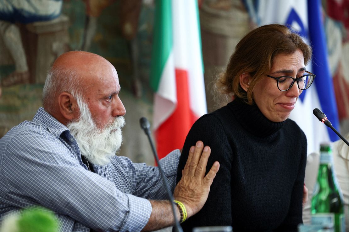 Naama Miran, sister of Omri Miran, an Israeli hostage held by the Palestinian militant group Hamas, is consoled by their father, Dani Miran, during a press conference after meeting with Pope Francis, in Rome, Italy on April 8, 2024.