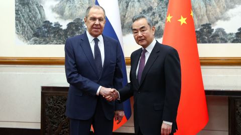 Russia's Foreign Minister Sergey Lavrov shakes hands with China's Foreign Minister Wang Yi during a meeting in Beijing on April 9.