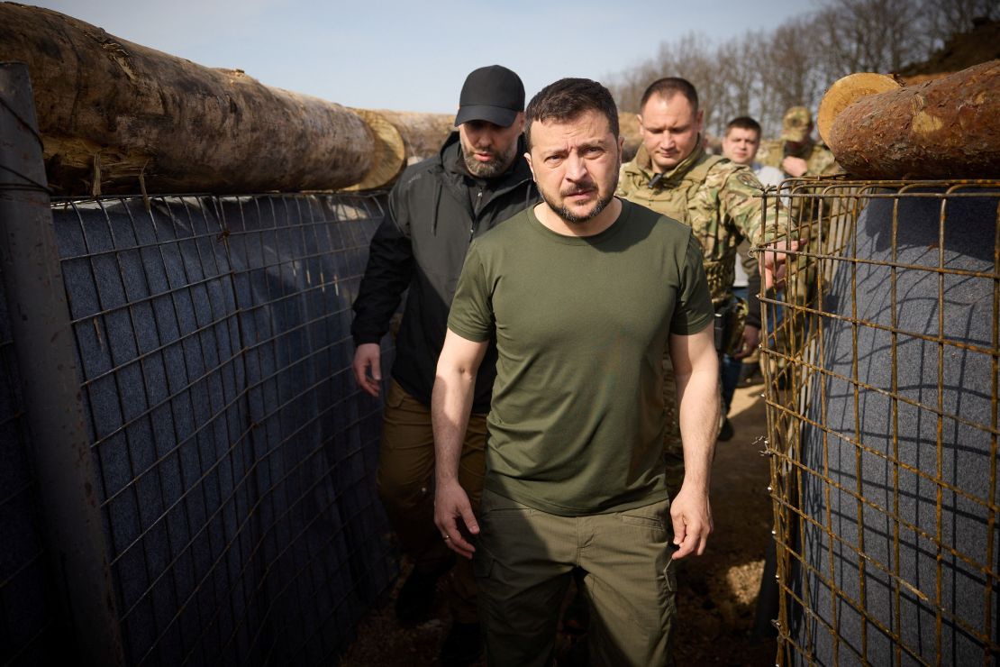 Ukraine's President Volodymyr Zelenskiy inspects new fortifications for Ukrainian servicemen near the Russian border in the Kharkiv region on Tuesday. 