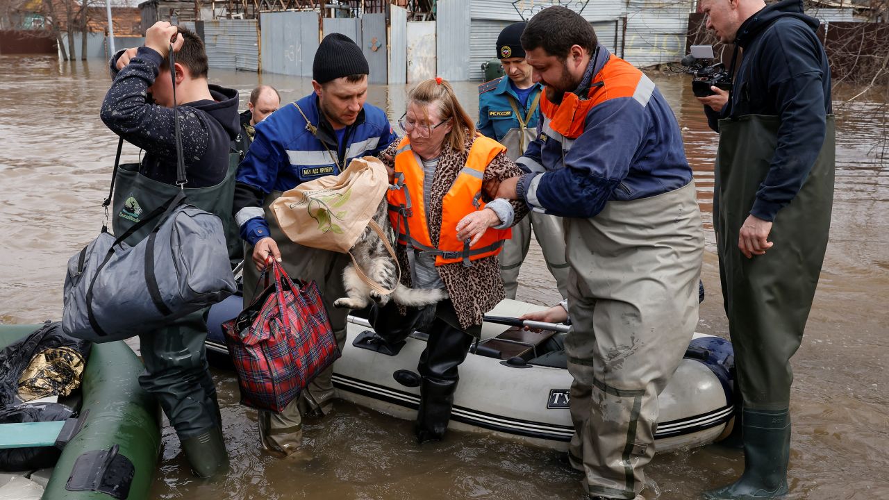 Local resident Taisia is evacuated amid flooding in the city of Orenburg, Russia April 10, 2024.