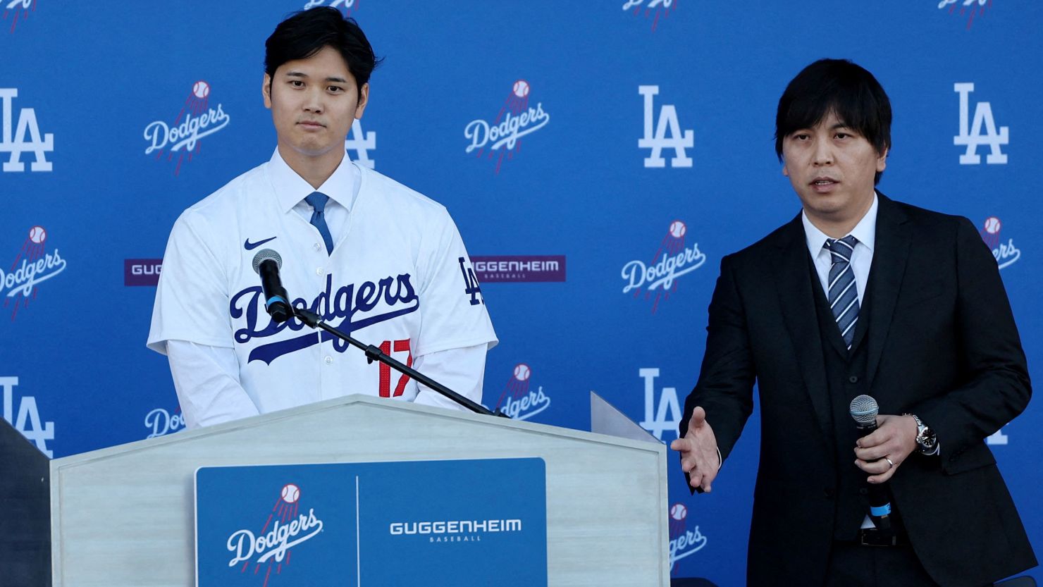Shohei Ohtani stands at a press conference at Centerfield Plaza, Dodger Stadium, Los Angeles, California, on December 14, 2023, with interpreter Ippei Mizuhara by his side.