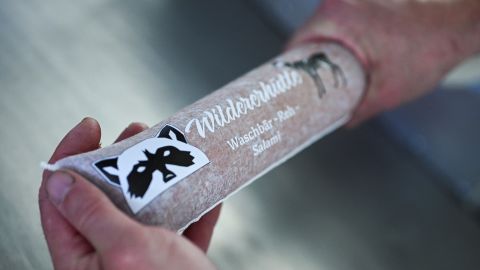 Hunter Michael Reiss makes a salami in his meat processing room at his wild butcher farm shop "Wildererhuette", where he processes racoon meat into sausages and meatballs, in Kade, state of Saxony-Anhalt, Germany April 11, 2024.