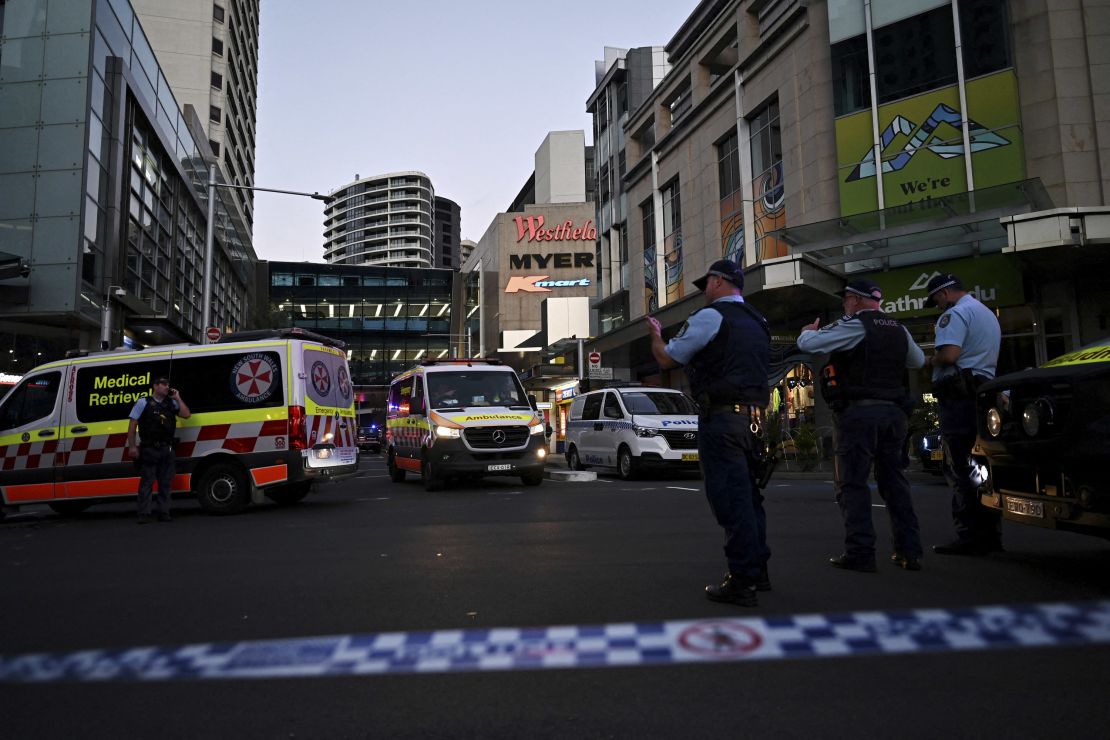 Emergency service workers gather near Bondi Junction after multiple people were stabbed inside the Westfield shopping centre in Sydney on April 13.