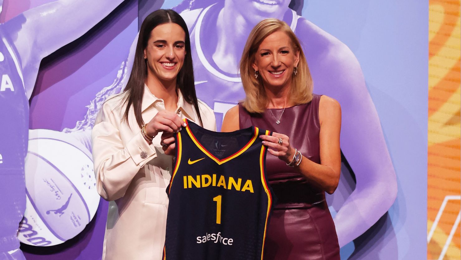 Caitlin Clark poses with WNBA commissioner Cathy Engelbert after she is selected with the No. 1 overall pick to the Indiana Fever.